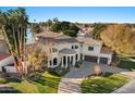 Luxury home with tile roof and a circular driveway, offering waterfront living at 1519 E Treasure Cove Dr, Gilbert, AZ 85234