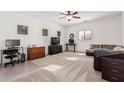 Bright bedroom with carpeted floor, and home office area at 16705 N 175Th Dr, Surprise, AZ 85388