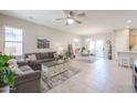 Spacious living room with comfortable seating and neutral colors at 16916 W Eureka Springs Dr, Surprise, AZ 85387