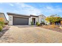 Beautiful home exterior with a large driveway and landscaping at 17535 E Silver Sage Ln, Rio Verde, AZ 85263