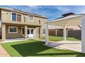 Backyard with artificial turf, a gazebo, and a view of the house's back at 224 S 151St Ave, Goodyear, AZ 85338