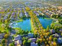 Gorgeous aerial view of the community showcasing lush landscaping, serene lakes, and a park at 4188 E Lexington Ave, Gilbert, AZ 85234
