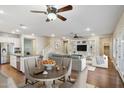 Inviting open-concept living space featuring hardwood floors and built-in shelving for storage and display at 4188 E Lexington Ave, Gilbert, AZ 85234