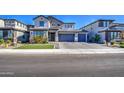 Modern two-story home with a three-car garage and neatly landscaped front yard at 4507 S 119Th Dr, Avondale, AZ 85323