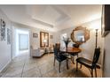 Bright dining area with a table and chairs, and access to other rooms at 5543 W Gardenia Ave, Glendale, AZ 85301