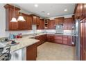 Modern kitchen featuring granite countertops and a breakfast bar at 10260 E White Feather Ln # 2003, Scottsdale, AZ 85262