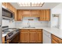 Kitchen with wood cabinets and stainless steel appliances at 10330 W Thunderbird Blvd # C119, Sun City, AZ 85351