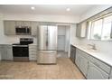 Renovated kitchen featuring stainless steel appliances and updated cabinets at 10331 W Willie Low Cir, Sun City, AZ 85351