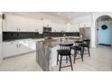 Modern kitchen featuring white cabinets and granite island at 10713 E Hawk Ave, Mesa, AZ 85212