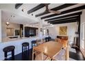 Bright dining area with wood table and seating for six at 1308 E Gardenia Dr, Phoenix, AZ 85020