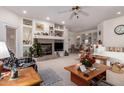 Bright living room with fireplace and built-in shelving at 13840 N Mirage Heights W Ct # 217, Fountain Hills, AZ 85268