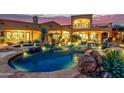 Expansive pool and spa with a mountain backdrop at 14179 E Kalil Dr, Scottsdale, AZ 85259