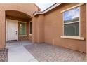 Front entrance with a white door and arched entryway at 14353 W Ventura St, Surprise, AZ 85379