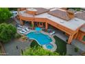 Aerial view of a stunning pool and spa area with lounge chairs at 14521 E Desert Vista Trl, Scottsdale, AZ 85262