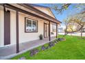 Inviting front porch with stone accents and landscaping at 14821 N 60Th Dr, Glendale, AZ 85306