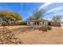 Charming single story home with a large front yard and mature trees at 1743 W Verde Ln, Phoenix, AZ 85015