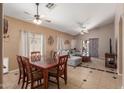 Open dining area with a wooden table and view of the living room at 1825 N Lewis Pl, Casa Grande, AZ 85122