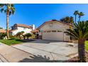 View of the home's exterior, including the driveway and landscaping at 19037 N 73Rd Ln, Glendale, AZ 85308