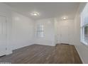 Bright and airy living room with hardwood floors at 20249 W Woodlands Ave, Buckeye, AZ 85326