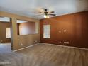 Open living area with a tan and orange color scheme at 20356 N 261St Dr, Buckeye, AZ 85396