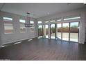 Bright living room with large sliding glass doors leading to the backyard at 21537 W Pierson St, Buckeye, AZ 85396