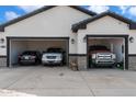 Three-car garage with ample space for vehicles and storage at 23527 W Estes Way, Buckeye, AZ 85326