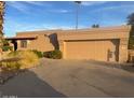 Single-story home with a neutral color scheme and a spacious two-car garage in a well-maintained neighborhood at 25609 N Forest Rd # 20, Rio Verde, AZ 85263