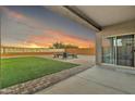 Covered patio overlooking the backyard with seating area at 2562 N Abbey Rd, Casa Grande, AZ 85122