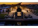 Night view of community clubhouse with fireplace and seating area at 26096 S 228Th Pl, Queen Creek, AZ 85142