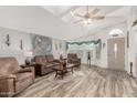 Bright living room featuring hardwood floors and comfy seating at 3301 S Goldfield Rd # 5027, Apache Junction, AZ 85119