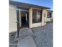 Front exterior view of a single story home with open door at 3646 N 69Th Ave # 55, Phoenix, AZ 85033