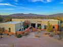 Single-story home with landscaped yard and mountain views at 38844 N Spur Cross Rd, Cave Creek, AZ 85331