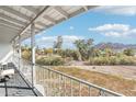 Covered balcony overlooking a scenic landscape with mountain views at 4344 E Desert Crest Dr, Paradise Valley, AZ 85253