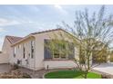 Single story home with gray shutters and a nicely landscaped yard at 5609 W Posse Dr, Eloy, AZ 85131