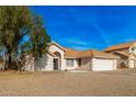 Single-story house with tile roof and neutral exterior at 6634 E Preston St, Mesa, AZ 85215