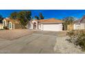 Front view of a single-story house with a two-car garage at 6634 E Preston St, Mesa, AZ 85215