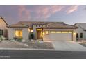 One-story house with a neutral color scheme and front yard at 7227 E Texas Ebony Dr, Gold Canyon, AZ 85118