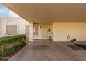 Covered carport with view of home's entrance at 7911 E Desert Trl, Mesa, AZ 85208