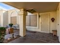 Covered entryway with tile flooring and seating area at 7911 E Desert Trl, Mesa, AZ 85208