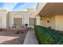 Landscaped front yard with walkway and shrubs at 7911 E Desert Trl, Mesa, AZ 85208