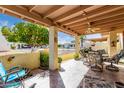 Covered patio with seating area and view of community at 7911 E Desert Trl, Mesa, AZ 85208