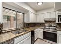 Modern kitchen with granite countertops and stainless steel appliances at 921 E Becker Ln, Phoenix, AZ 85020