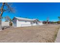 White brick ranch house with attached garage at 955 N Jay St, Chandler, AZ 85225