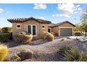 One-story home with stone accents and drought-tolerant landscaping at 20089 N 263Rd Dr, Buckeye, AZ 85396