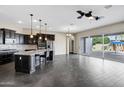 Spacious kitchen with granite countertops, dark cabinetry, and stainless steel appliances at 22174 E Creekside Dr, Queen Creek, AZ 85142