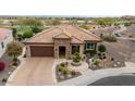 Single-story home with tile roof and nicely landscaped yard; golf course view at 26702 W Sierra Pinta Dr, Buckeye, AZ 85396