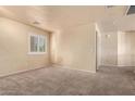 Spacious bedroom with neutral walls and carpeted floors at 6512 W Eagle Talon Trl, Phoenix, AZ 85083