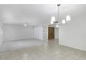 Open dining area with tiled floors and view to entry at 811 S Revolta Cir, Mesa, AZ 85208