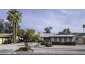 Single-story home with landscaped yard and driveway at 811 S Revolta Cir, Mesa, AZ 85208