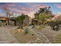 Luxury home showcasing desert landscaping and a welcoming entryway at 10639 E Fernwood Ln, Scottsdale, AZ 85262